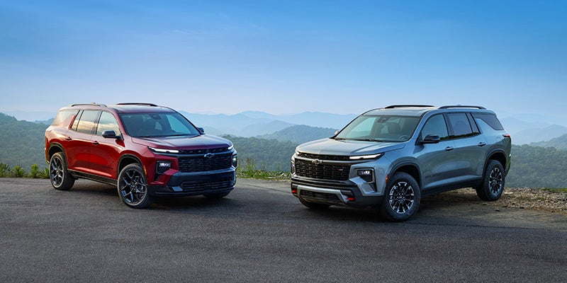 Two 2024 Chevy Traverse SUVs parked in a lot