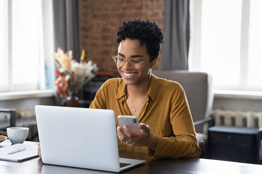 A woman on a laptop applying for financing