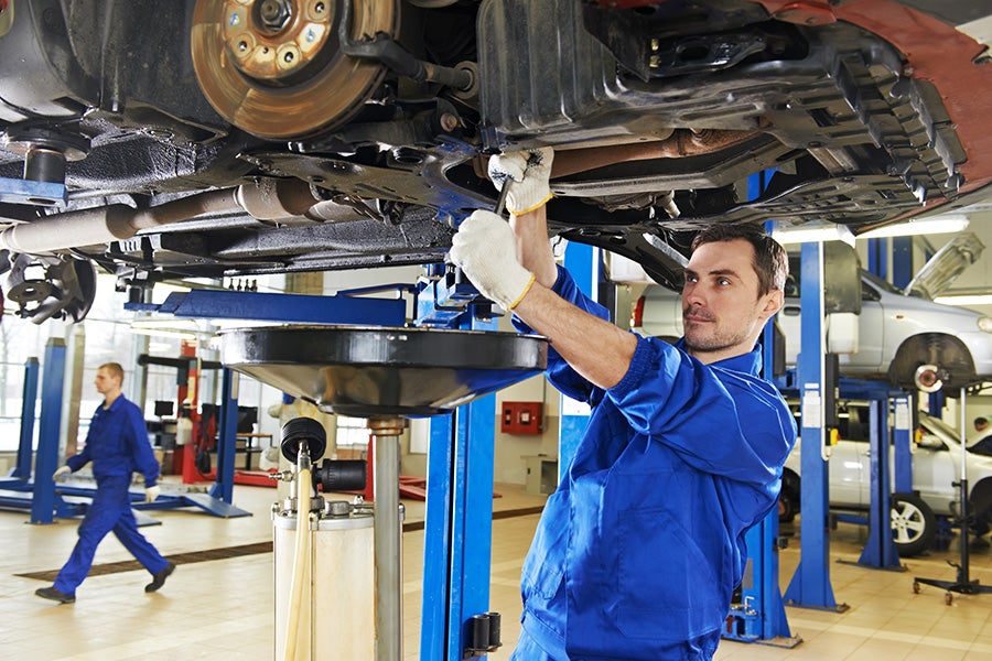 A mechanic working on a car 